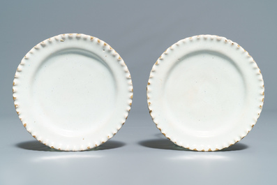 Four white Dutch Delft jugs, a pair of lobed plates and a large shaker, 17/18th C.