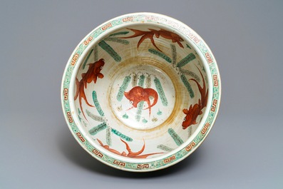 A Chinese blue-ground famille verte fishbowl, 19th C.