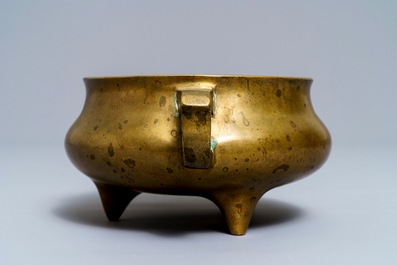 A Chinese bronze tripod censer, Qianlong mark, 19th C.