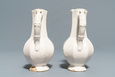 Four white Dutch Delft jugs, a pair of lobed plates and a large shaker, 17/18th C.