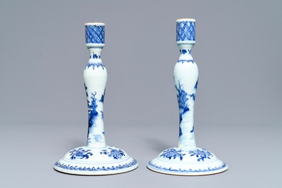 A pair of Chinese blue and white candlesticks, Kangxi/Qianlong