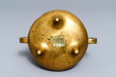 A Chinese bronze tripod censer, Qianlong mark, 19th C.