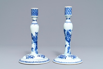 A pair of Chinese blue and white candlesticks, Kangxi/Qianlong