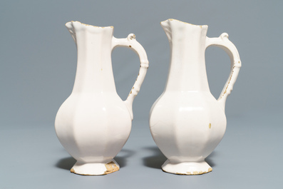 Four white Dutch Delft jugs, a pair of lobed plates and a large shaker, 17/18th C.