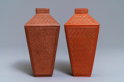 A pair of Chinese Yixing stoneware relief-decorated tea caddies, seal mark, 18th C.