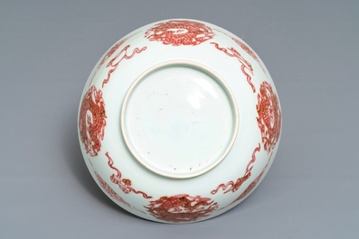 A Chinese underglaze red 'dragons and fish' bowl, 19/20th C.