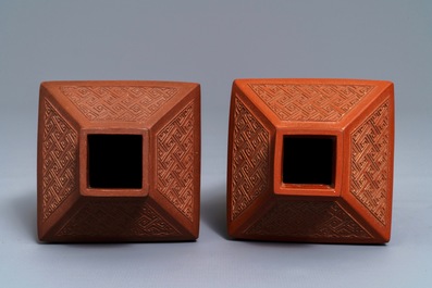 A pair of Chinese Yixing stoneware relief-decorated tea caddies, seal mark, 18th C.