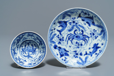 Six Chinese celadon and blue and white 'crabs and fish' cups and saucers, Kangxi