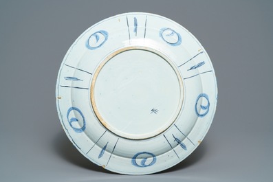 An exceptionally fine large Dutch Delft blue and white 'peacock and flowers' dish, 17th C.
