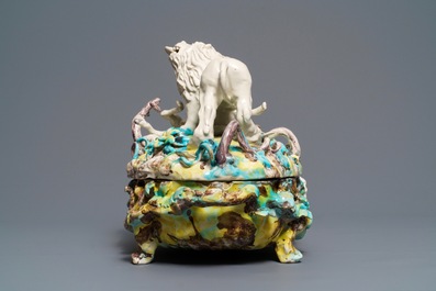 A large and impressive Brussels faience tureen with a lion fighting a dog, 1st half 18th C.