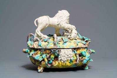 A large and impressive Brussels faience tureen with a lion fighting a dog, 1st half 18th C.