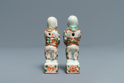 Four Chinese 'Tek Sing Cargo' biscuit boys and a pair of famille verte Hoho boys, Kangxi