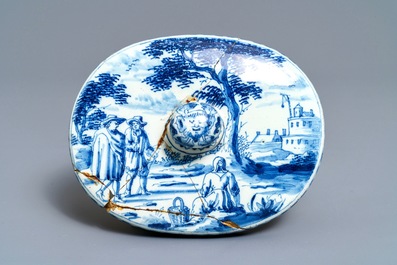 A pair of Dutch Delft polychrome slippers, a miniature jug and a fine lid, 18th C.