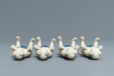 Four Chinese 'Tek Sing Cargo' biscuit boys and a pair of famille verte Hoho boys, Kangxi
