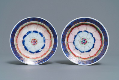 A pair of Chinese famille rose 'lotus' bowls and covers on stands, Qianlong