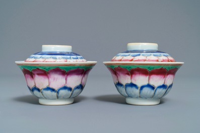 A pair of Chinese famille rose 'lotus' bowls and covers on stands, Qianlong
