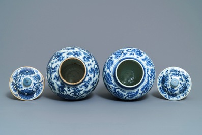 Two Chinese blue and white 'lotus scroll' vases and covers, Kangxi