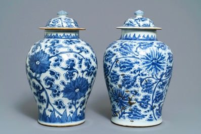 Two Chinese blue and white 'lotus scroll' vases and covers, Kangxi