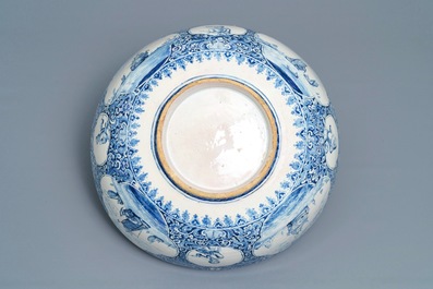 A fine and large Dutch Delft blue and white 'maritime subject' bowl depicting Atlas, 18th C.