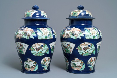 A pair of famille verte powder blue-ground vases and covers, Samson, Paris, 19th C.
