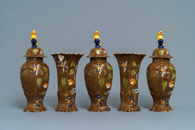 A polychrome Dutch Delft five-piece 'capucin brown-ground' garniture, 18th C.