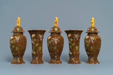 A polychrome Dutch Delft five-piece 'capucin brown-ground' garniture, 18th C.
