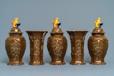 A polychrome Dutch Delft five-piece 'capucin brown-ground' garniture, 18th C.