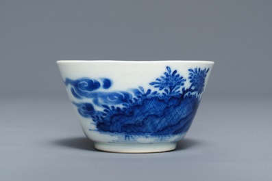 A Chinese blue and white 'soft paste' cup and saucer with an unusual scene with slaves, Qianlong
