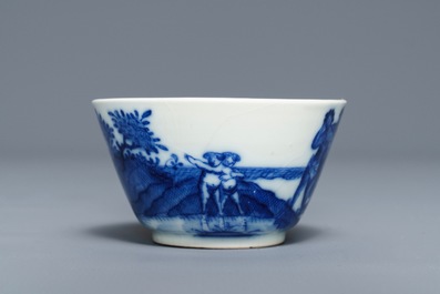 A Chinese blue and white 'soft paste' cup and saucer with an unusual scene with slaves, Qianlong