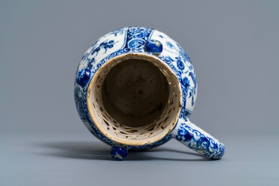 A Dutch Delft blue and white chinoiserie puzzle jug, dated 1743