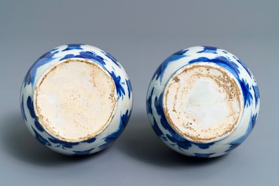A pair of Dutch Delft blue and white chinoiserie bottle vases, 1st half 18th C.
