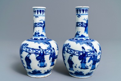 A pair of Dutch Delft blue and white chinoiserie bottle vases, 1st half 18th C.
