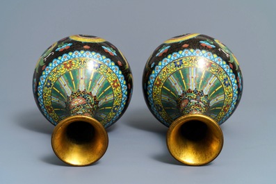 A pair of Chinese cloisonn&eacute; bottle vases, two silver saucers and a silver cup, 19/20th C.
