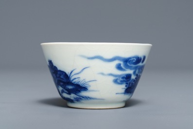 A Chinese blue and white 'soft paste' cup and saucer with an unusual scene with slaves, Qianlong