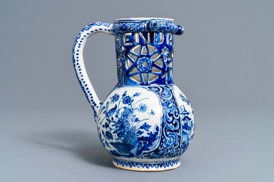 A Dutch Delft blue and white chinoiserie puzzle jug, dated 1743