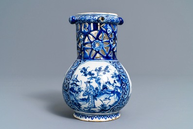 A Dutch Delft blue and white chinoiserie puzzle jug, dated 1743