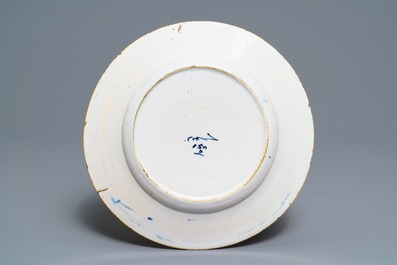 A Dutch Delft blue and white 'peacock's tail' dish and a pair of plates, 18th C.
