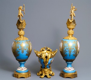 A pair of massive gilt bronze-mounted S&egrave;vres porcelain ewers and a jardini&egrave;re, France, 19th C.