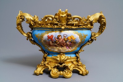 A pair of massive gilt bronze-mounted S&egrave;vres porcelain ewers and a jardini&egrave;re, France, 19th C.