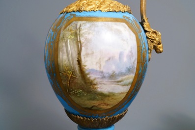 A pair of massive gilt bronze-mounted S&egrave;vres porcelain ewers and a jardini&egrave;re, France, 19th C.