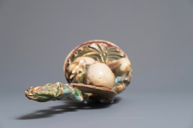 A polychrome Chinese ivory group of a sage with a tiger, 19/20th C.