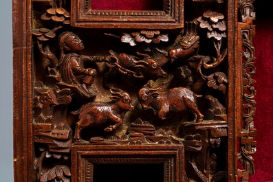 Two Chinese carved wood frames with dragons and figures, ca. 1900
