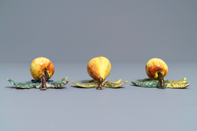 Two polychrome Dutch Delft models of apples and one of a pear, 18th C.