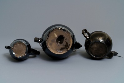 Two silver-mounted Namur black-glazed pottery jugs and a teapot, 18th C.