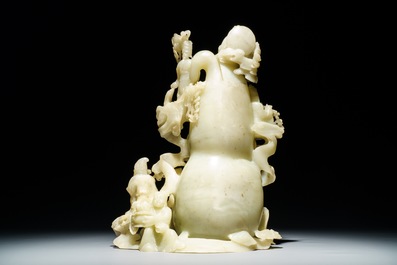 A Chinese pale green jade 'immortals' vase, 20th C.