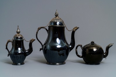 Two silver-mounted Namur black-glazed pottery jugs and a teapot, 18th C.