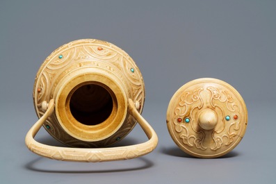 A Chinese coral and turquoise-inlaid ivory vase and cover, 1st half 20th C.