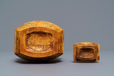 A Chinese archaistic ivory vase and cover on wooden stand, ca. 1900