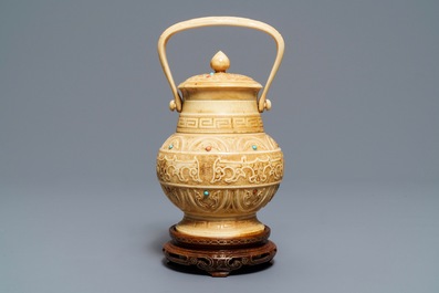 A Chinese coral and turquoise-inlaid ivory vase and cover, 1st half 20th C.