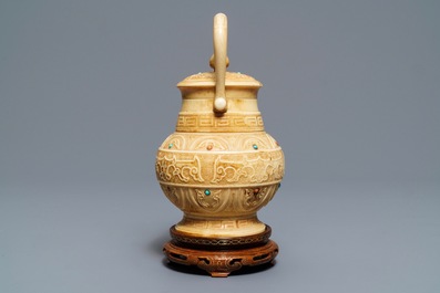 A Chinese coral and turquoise-inlaid ivory vase and cover, 1st half 20th C.